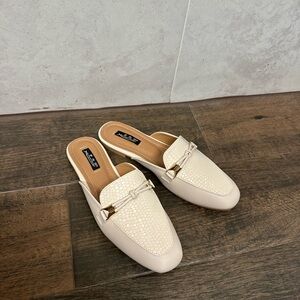 Elegant Cream mules with snake skin print